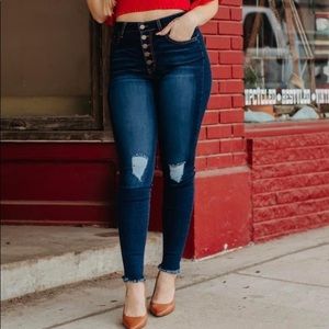 Dark wash ripped skinny jeans with button